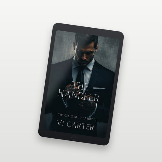 Tablet displaying the book cover of 'The Handler' by VI Carter on a white background