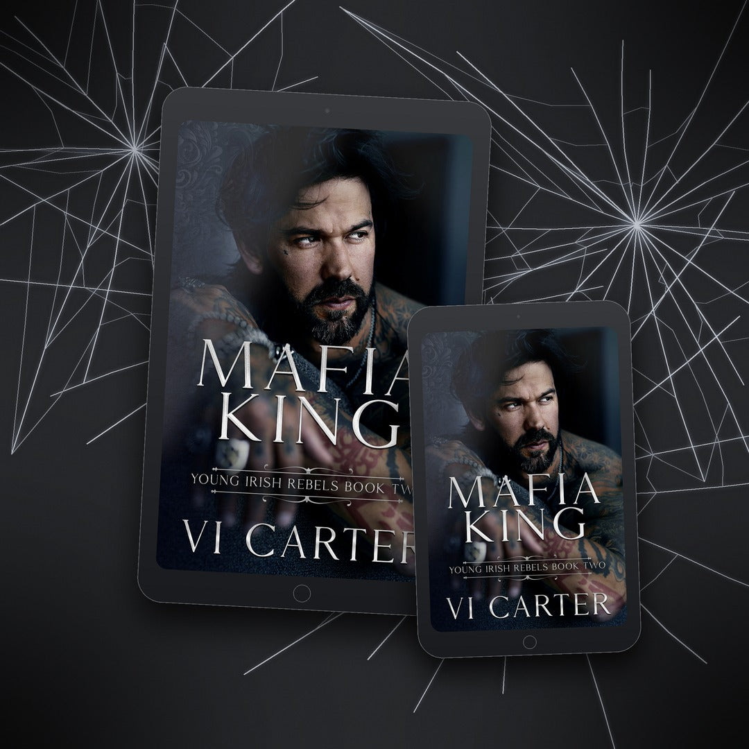 Two tablets displaying the book cover of 'Mafia King' by Vi Carter on a dark background with spider web design.