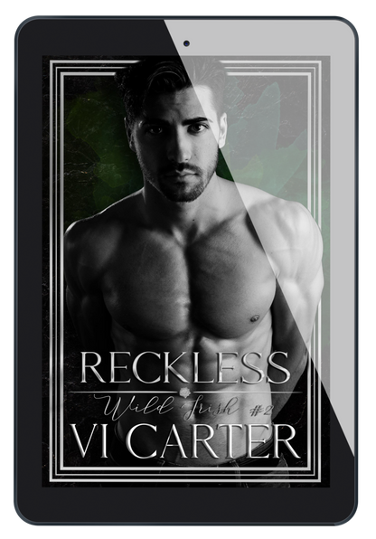 This image features the cover of the book titled "Reckless #2" by Vi Carter. The cover displays a striking black and white photograph of a male figure with a intense gaze, set against a dark background.