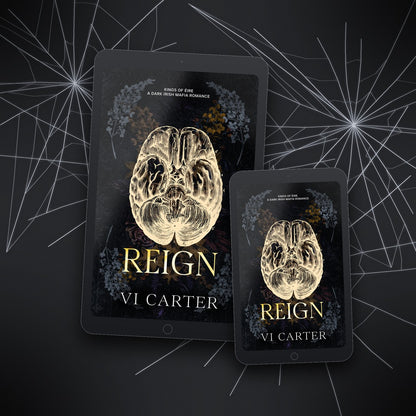 Two tablets displaying the book cover of 'Reign' by Vi Carter against a dark background with spider web design.