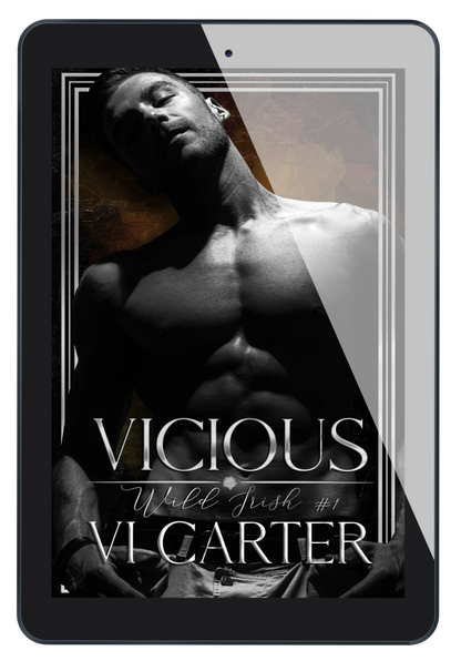 This image features the cover of the book "Vicious #1" by Vi Carter, displayed on a tablet. The book cover is striking with its dark, moody aesthetic and prominently features a male figure with a intense gaze, adding to the novel's dramatic feel.