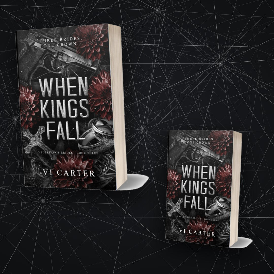 When Kings Fall by Vi Carter — two paperback copies against cracked glass